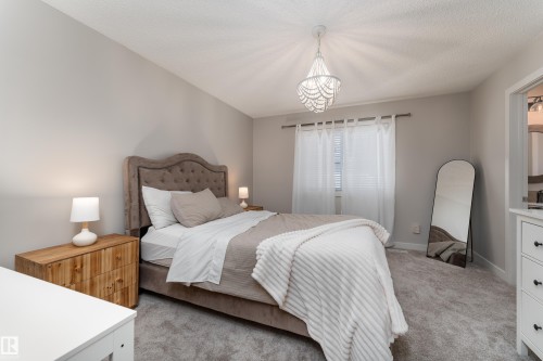 Neutral-toned bedroom featuring plush gray carpeting and light gray wall paint - 22064 95 Avenue, Edmonton, AB - Indoor Photo Showing Bedroom