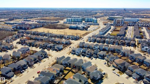 Aerial perspective showcasing a residential development with a mix of detached homes and townhouses - 22064 95 Avenue, Edmonton, AB - Outdoor With View