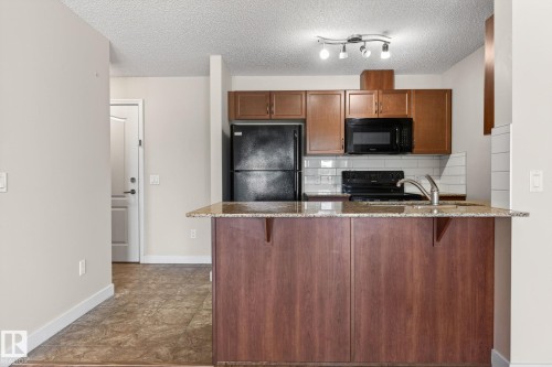 309 12660 142 Avenue, Edmonton, AB - Indoor Photo Showing Kitchen With Double Sink