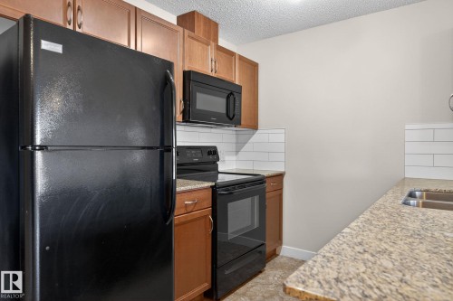 309 12660 142 Avenue, Edmonton, AB - Indoor Photo Showing Kitchen With Double Sink