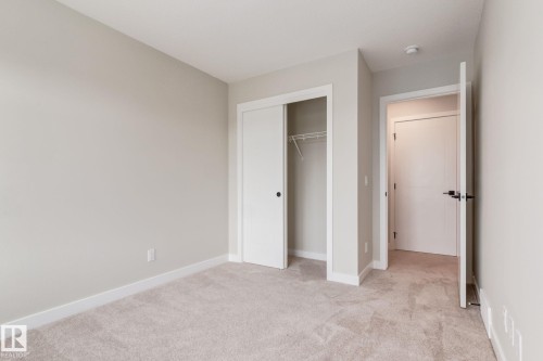 Room featuring neutral wall tones and light-colored carpeting - 44 16231 19 Avenue, Edmonton, AB - Indoor Photo Showing Other Room
