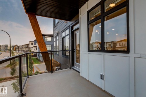 Balcony with concrete flooring and glass railing - 44 16231 19 Avenue, Edmonton, AB - Outdoor With Balcony With Exterior