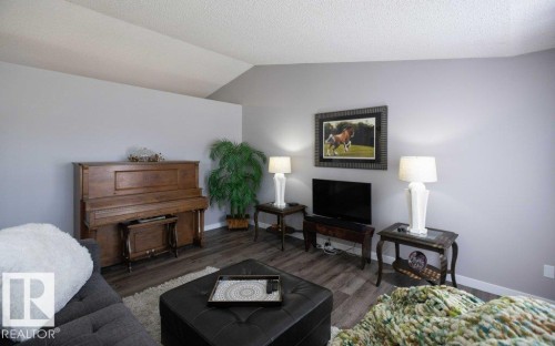 Vaulted ceiling with textured finish - 10812 109 Street, Westlock, AB - Indoor Photo Showing Living Room