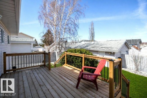 Spacious wood deck with black metal balusters and wood railing - 10812 109 Street, Westlock, AB - Outdoor With Deck Patio Veranda