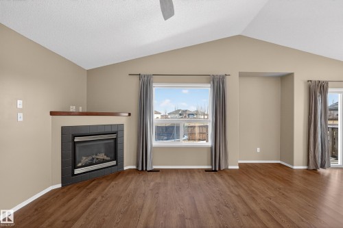 3779 18 Street, Edmonton, AB - Indoor Photo Showing Living Room With Fireplace