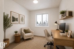 Compact room featuring light-colored walls and carpet flooring - 