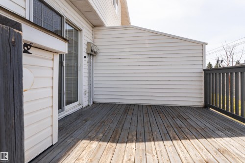 Wood-finish deck with a gray railing - #63 1033 Youville Dr W Nw, Edmonton, AB - Outdoor With Deck Patio Veranda With Exterior