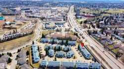 Aerial perspective showcasing a residential community with multi-lane thoroughfares - 
