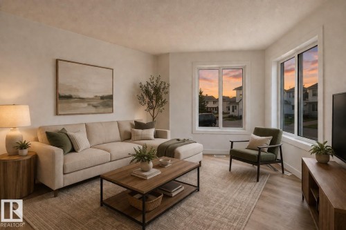 Living area with wood-finish flooring, multiple large windows, and neutral wall tones - #63 1033 Youville Dr W Nw, Edmonton, AB - Indoor Photo Showing Living Room