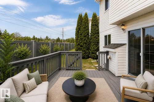 Spacious outdoor deck with composite decking and dark grey railing - #63 1033 Youville Dr W Nw, Edmonton, AB - Outdoor With Deck Patio Veranda With Exterior