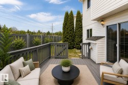 Spacious outdoor deck with composite decking and dark grey railing - 