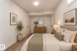 Carpeted room with a flush-mount ceiling light and white baseboards - 