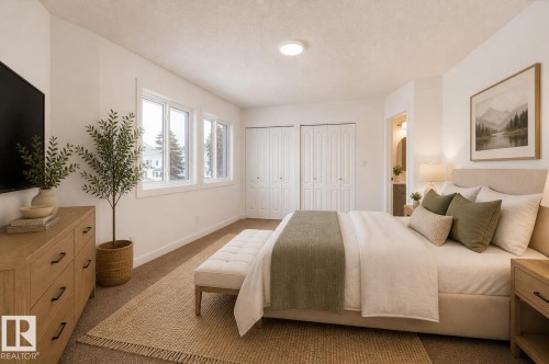 Bright interior room with multiple windows, two sets of bifold closet doors, a neutral wall color, and recessed ceiling lighting - #63 1033 Youville Dr W Nw, Edmonton, AB - Indoor Photo Showing Bedroom