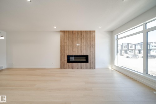 92 Blackbird Bend E, Fort Saskatchewan, AB - Indoor Photo Showing Living Room With Fireplace