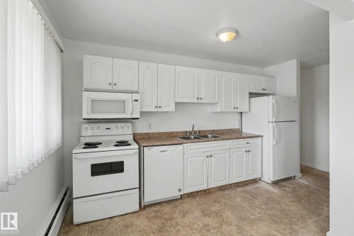 604F 2908 116A Avenue Nw, Edmonton, AB - Indoor Photo Showing Kitchen With Double Sink