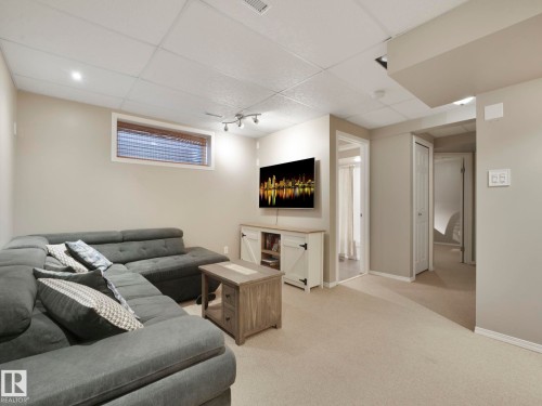 Living area with neutral tone carpet, recessed lighting, and a window with blinds - 21360 88 Avenue, Edmonton, AB - Indoor Photo Showing Basement