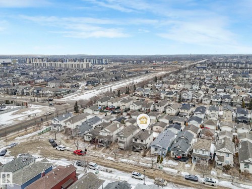 Aerial view showcasing the residential neighbourhood, with a clear blue sky overhead - 21360 88 Avenue, Edmonton, AB - Outdoor With View