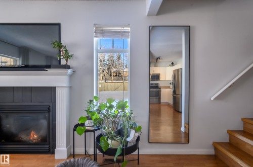 1-30 Levasseur Road, St. Albert, AB - Indoor Photo Showing Living Room With Fireplace