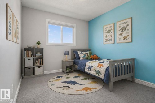 Light grey wall with a single window and a contrasting blue accent wall - 332 Nelson Drive, Spruce Grove, AB - Indoor Photo Showing Bedroom