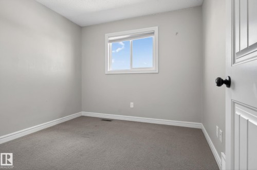 Room featuring light gray painted walls, white trim, and gray carpet flooring - 332 Nelson Drive, Spruce Grove, AB - Indoor Photo Showing Other Room