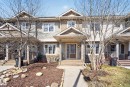 Townhome exterior featuring horizontal siding and stone accents - 332 Nelson Drive, Spruce Grove, AB  - Outdoor With Facade 