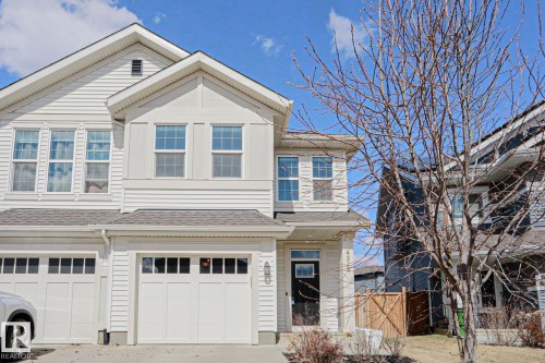 White-sided multi-level residence featuring a gray shingled roof - 4314 Cooke Lane, Edmonton, AB - Outdoor