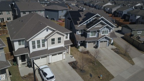 Contemporary two-story residence with a gray shingled roof - 4314 Cooke Lane, Edmonton, AB - Other