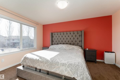 Comfortably fits a king size bed. Custom blackout blinds installed in window - 1019 177 Street, Edmonton, AB - Indoor Photo Showing Bedroom
