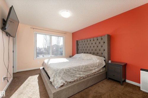Comfortably fits a king size bed. Custom blackout blinds installed in window - 1019 177 Street, Edmonton, AB - Indoor Photo Showing Bedroom