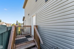 Exterior deck with wood railing and steps - 