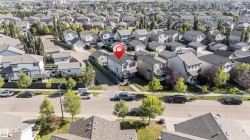 Residential neighborhood featuring numerous detached homes with varying architectural styles - 