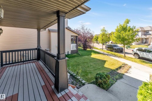 Covered porch with composite decking and black railings - 1921 119A Street, Edmonton, AB - Outdoor With Deck Patio Veranda With Exterior
