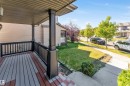 Covered porch with composite decking and black railings - 1921 119A Street, Edmonton, AB  - Outdoor With Deck Patio Veranda With Exterior 