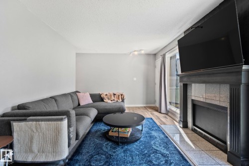 8 1020 41 Street, Edmonton, AB - Indoor Photo Showing Living Room With Fireplace