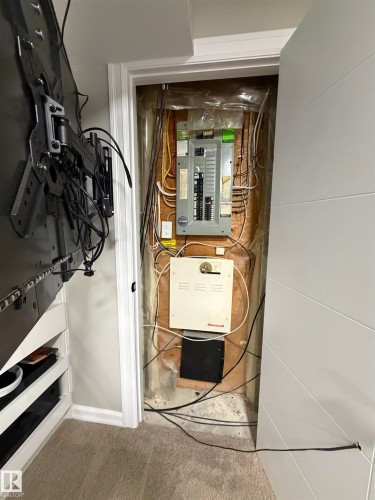 Utility closet featuring an electrical service panel and a Honeywell system - 5204 4 Avenue, Edmonton, AB - Indoor