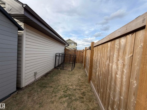 Side yard featuring a dog run. - 5204 4 Avenue, Edmonton, AB - Outdoor With Exterior