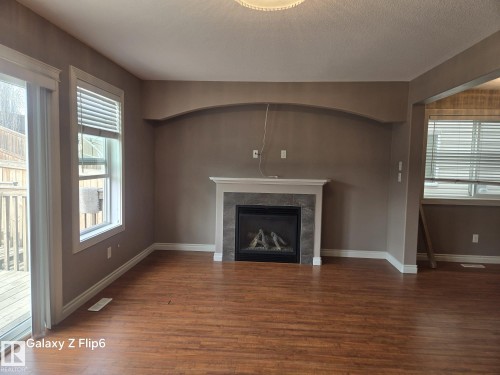 Edmonton, AB - Indoor Photo Showing Living Room With Fireplace