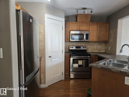 Edmonton, AB - Indoor Photo Showing Kitchen With Stainless Steel Kitchen With Double Sink