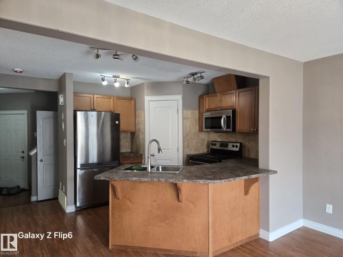 Edmonton, AB - Indoor Photo Showing Kitchen With Stainless Steel Kitchen With Double Sink