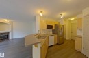 57 155 Crocus Crescent, Sherwood Park, AB  - Indoor Photo Showing Kitchen With Fireplace With Double Sink 
