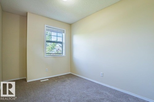 Bedroom 2 - 41 8304 11 Avenue, Edmonton, AB - Indoor Photo Showing Other Room