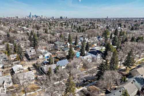 Expansive aerial view showcasing a residential neighborhood with a distant cityscape - 10954 62 Avenue, Edmonton, AB - Outdoor With View