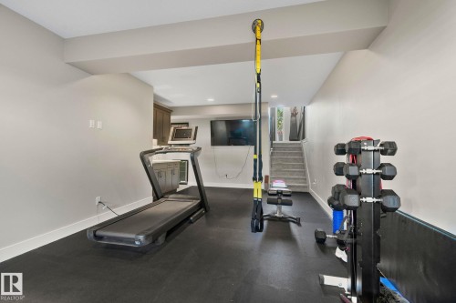 Dedicated fitness area featuring durable rubber flooring - 67 Enchanted Way Nw, St. Albert, AB - Indoor Photo Showing Gym Room