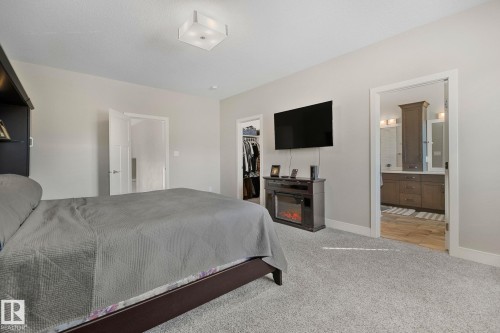 Spacious bedroom featuring light gray walls and plush gray carpeting - 67 Enchanted Way Nw, St. Albert, AB - Indoor Photo Showing Bedroom