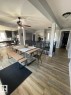 Open-concept dining area featuring wood-finish flooring - 5108 58 Avenue, Elk Point, AB  - Indoor 