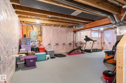 Unfinished basement offering exposed wood joists, a small window, and a concrete floor - 7114 22 Avenue, Edmonton, AB - Indoor Photo Showing Basement
