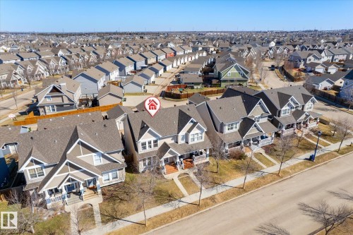 Gable-roofed home with light gray siding and white trim - 7114 22 Avenue, Edmonton, AB - Outdoor
