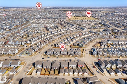 Expansive aerial perspective showcasing a residential development with numerous detached and attached homes - 7114 22 Avenue, Edmonton, AB - Outdoor With View