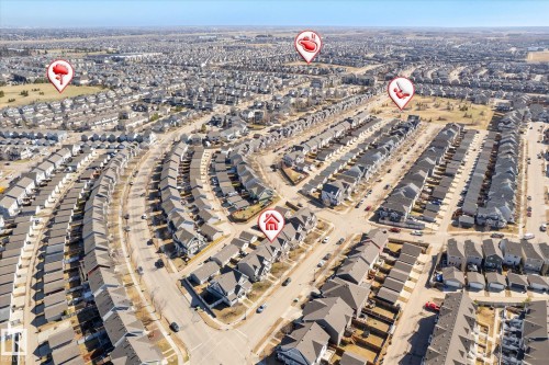 Aerial perspective of a dense residential development featuring numerous single-family homes with gray roofing - 7114 22 Avenue, Edmonton, AB - Outdoor