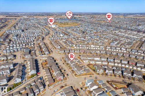Expansive suburban residential development featuring numerous single-family homes and townhomes, organized along curvilinear streets - 7114 22 Avenue, Edmonton, AB - Outdoor With View